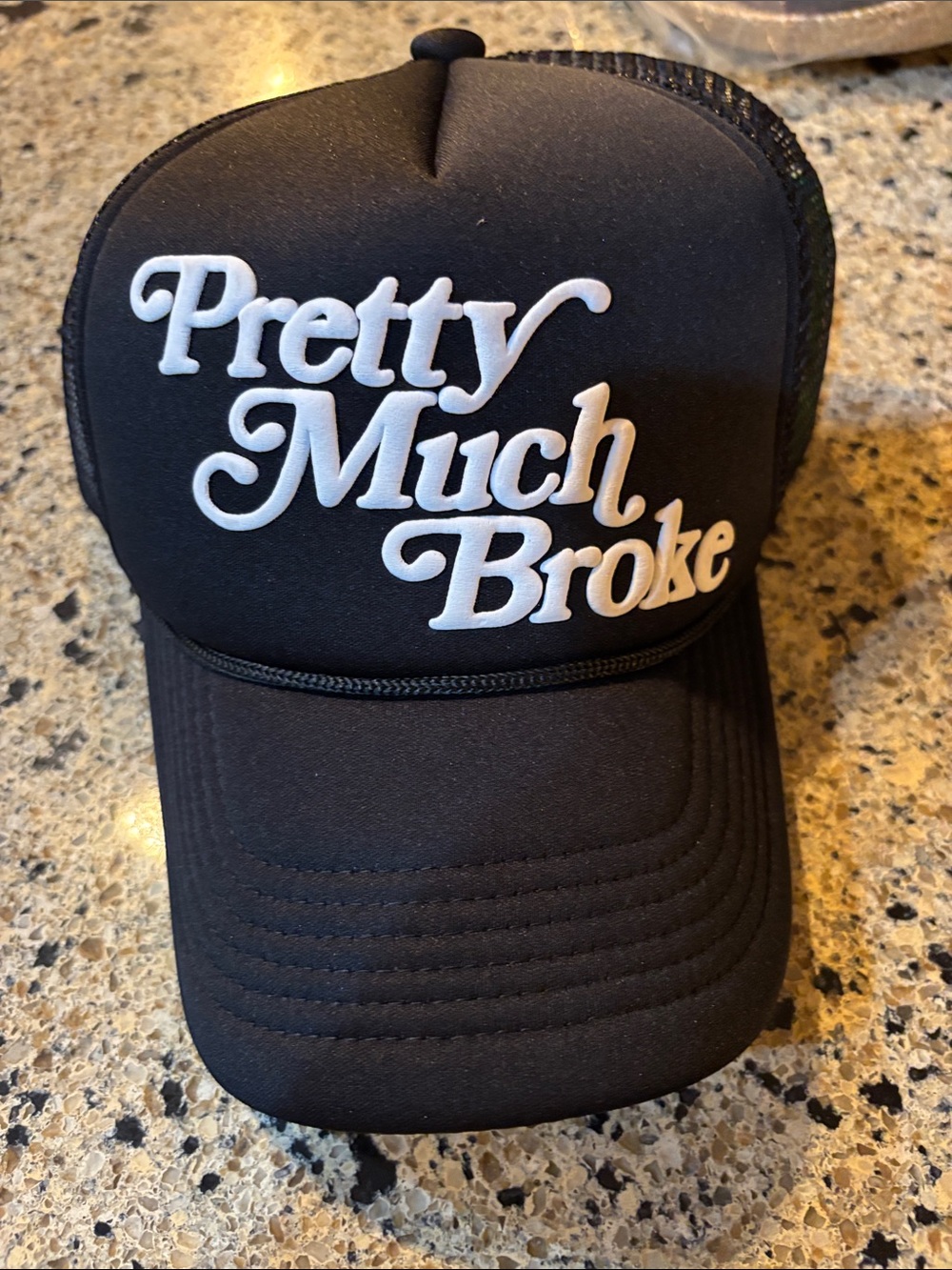 Black Trucker Hat with White 'Pretty Much Broke' Script